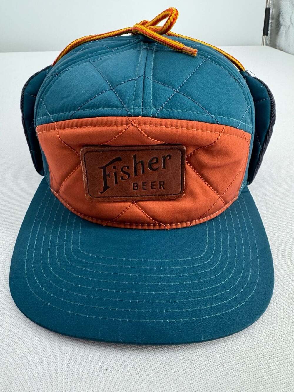 Fisher Beer Quilted Ear Flap Hat Teal Orange Leather Patch